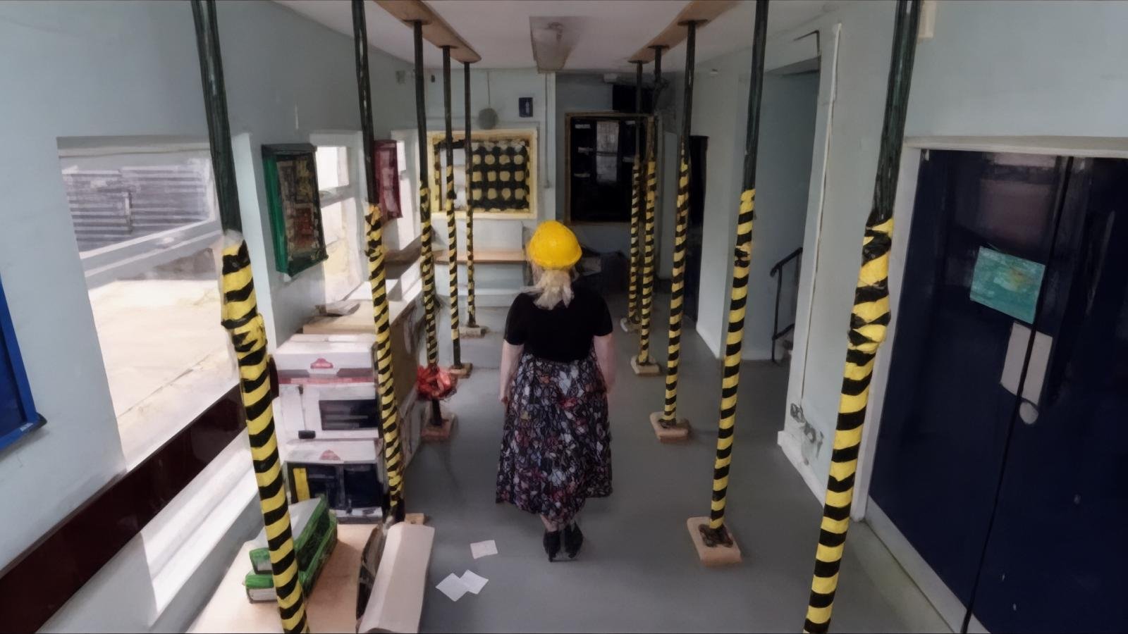 Expert structural engineer conducting comprehensive RAAC concrete assessment in school building - advanced non-destructive testing techniques identifying hidden concrete defects and safety